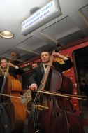 Musicians play on bass viols