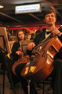 Musicians play on bass viols