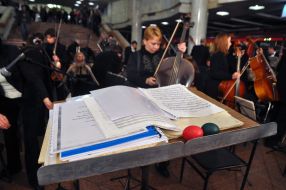 Musicians play on bass viols