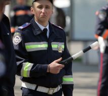 State Motor Vehicle Inspectorate worker regulates traveling motion