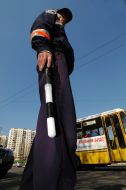State Motor Vehicle Inspectorate worker regulates traveling motion