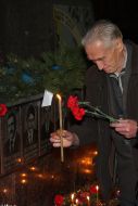 A veteran puts candle to Memorial to Heroes of Chernobyl