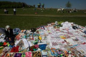 A woman sells towels