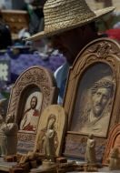 A man sells wooden icons