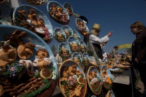 A man sells clay souvenirs