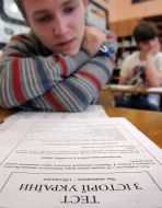 Schoolboy reads instruction