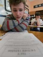 Schoolboy reads instruction