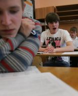 Schoolboy reads instruction