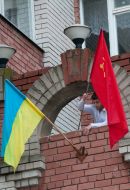 A boy places a Soviet flag