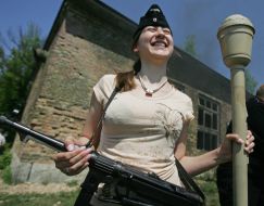 A girl in the German tankman field cap