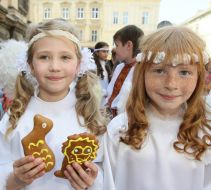 Festive parade children-participants are in the suits of angels