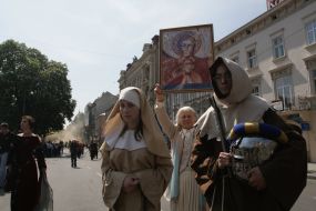 Festive parade participants