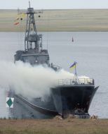 Fighting machines of infantry drive out from a large landing ship