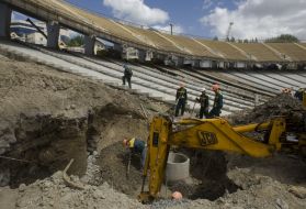 ABuilders work on ”Olympiyskiy” stadium