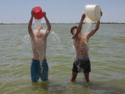 Young people poured by water