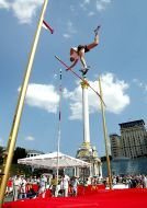 A sportsman executes a pole vault
