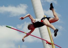 A sportsman executes a pole vault