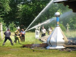 Firemen extinguish a church