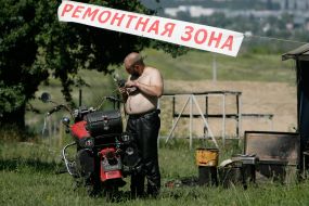 Bayker repairs a motor cycle