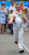 A father carries a child