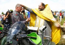 Priest blesses the participant of races