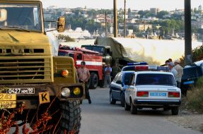 The traffic police cars stand near the Black sea Fleet of Russian Federation trucks column