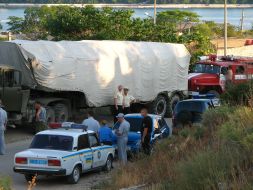 The traffic police cars stand near the Black sea Fleet of Russian Federation trucks column