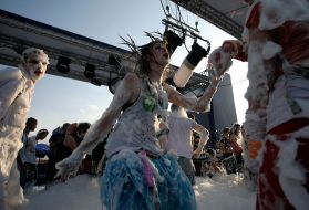 A girl dances in soap-suds