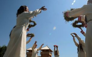 Girls in shirts carry out dance