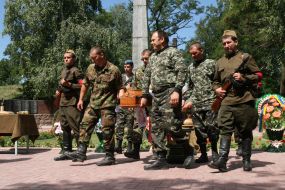 Servicemen carry a coffin