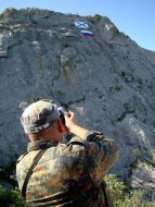 Flag of Russia and St. Andrew’s flag on a rock