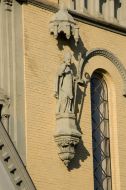 Sculpture of bishop on the facade of Roman Catholic church