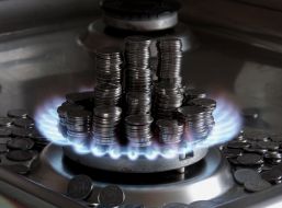 Coins on alight gas burner