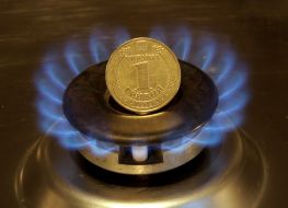 Coin on alight gas burner