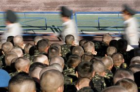 Cadets walk near a tree