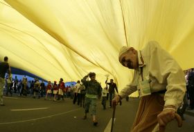 An elderly man asks plead for charity