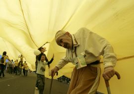 An elderly man asks plead for charity