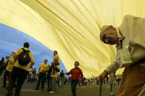 An elderly man asks plead for charity