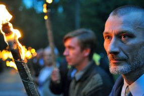 Polish bikers holds alight torches