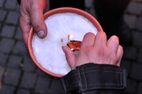 Biker kindles a candle