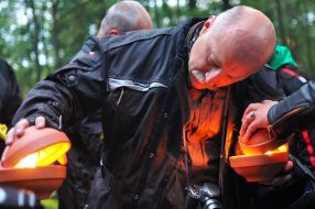 Biker kindles a candle