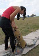 The participant of championship lays a parachute