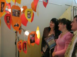 Visitors examine pictures