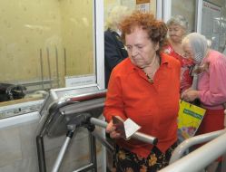 Pensioner going cross a turnstile