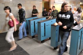 People going cross a turnstile