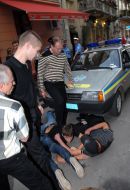 Young people lock the car of militia