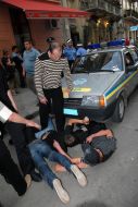 Young people lock the car of militia
