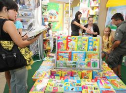 Visitors examine books
