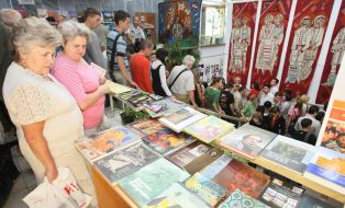 Visitors examine books