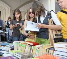 Visitors examine books